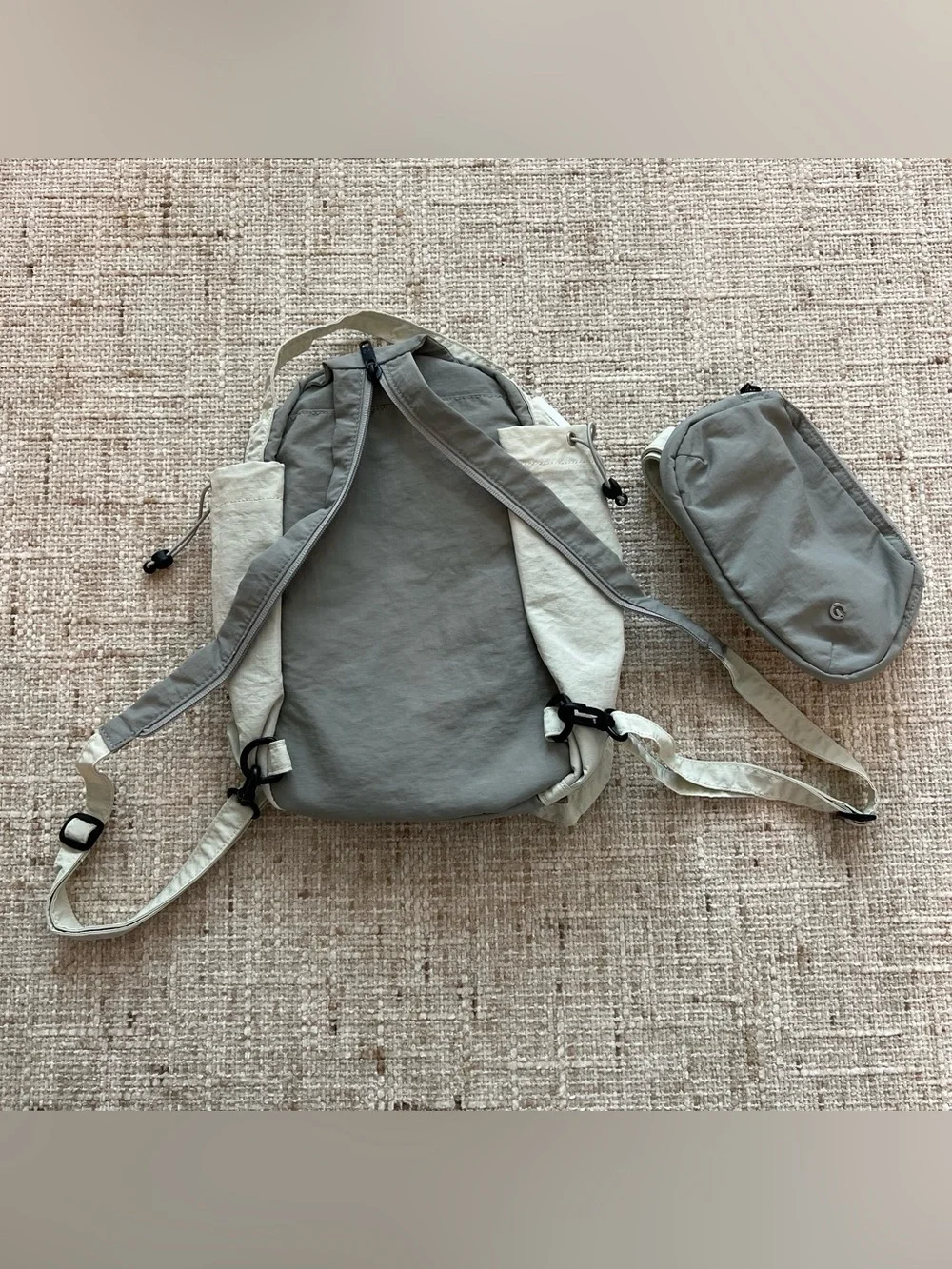 Glowmode gray backpack with detachable pouch and separate zip strap